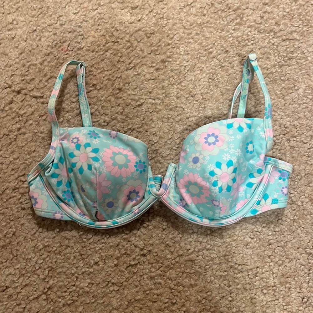 Ninety-Nine Brand, green faded with flowers and a v in the middle